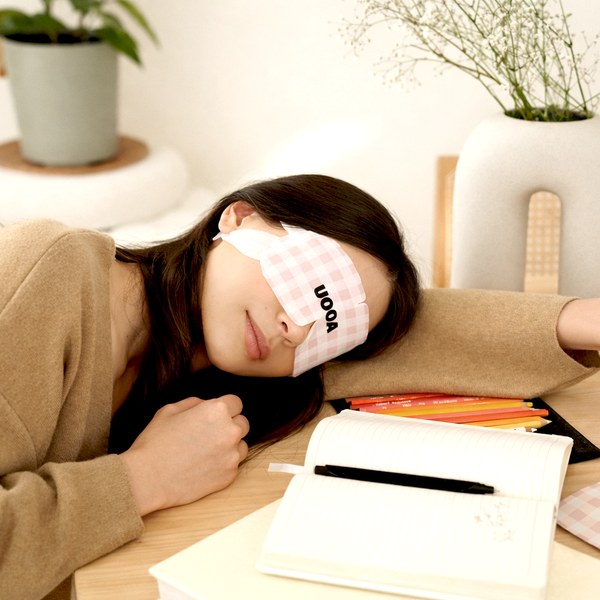 woman-sleeping-at-desk-wearing-steam-infused-eye-mask